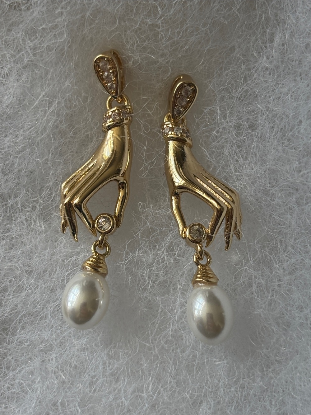 Gold Hand Holding Pearl Drop Earrings